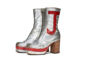 Elton John's monogrammed silver leather boots sold for nearly $100,000 at auction in New York. ©AFP