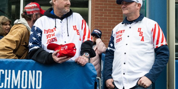 Supporters of former US president Donald Trump known as the Front Row Joes, including Scott Knuth (L) of Woodbridge, Virginia, wait in line to enter a rally in Richmond, Virginia, on March 2, 2024 / ©AFP