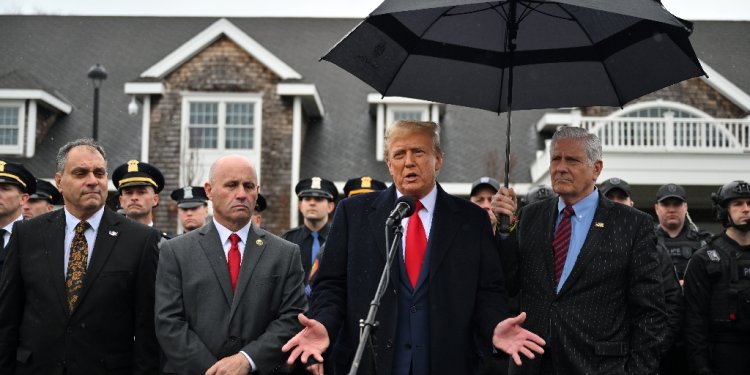 Former US president Donald Trump speaks to the press after attending the wake for New York Police Department (NYPD) Officer Jonathan Diller in Massapequa, Long Island, New York, on March 28, 2024 / ©AFP