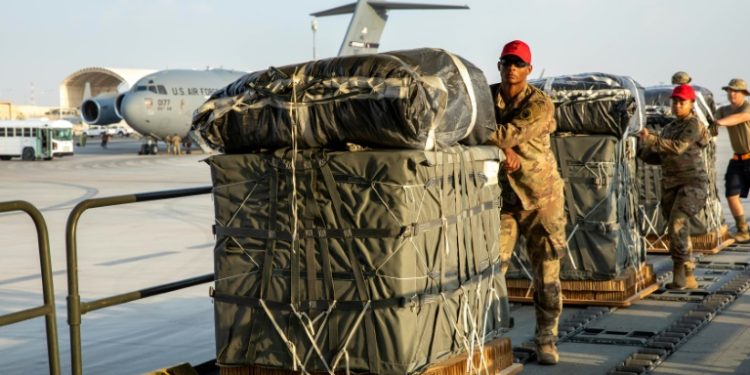 In this image obtained from the US Central Command, military personnel load humanitarian aid into US Air Force C-130 planes on March 5, 2024. ©AFP