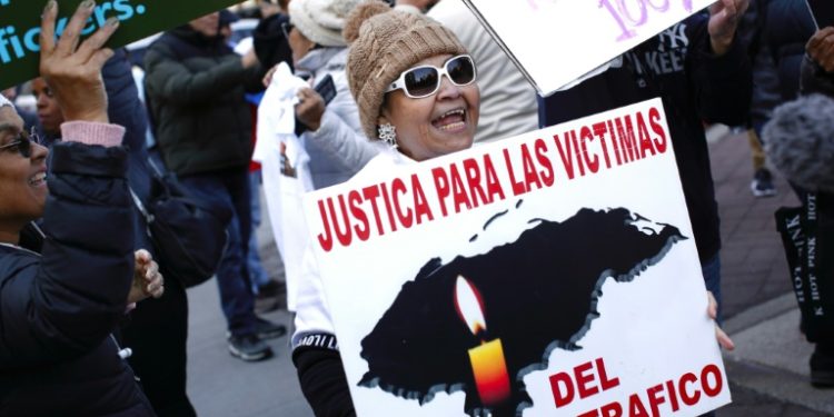 People react outside the Manhattan federal court after a jury found former Honduran president Juan Orlando Hernandez guilty of drug trafficking, on March 8, 2024. ©AFP