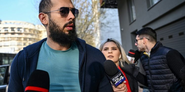 Controversial influencer Andrew Tate was indicted for human trafficking and other charges in Romania together with his brother Tristan. ©AFP