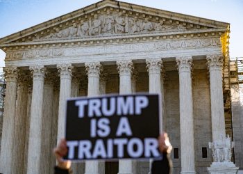 Anti-Trump demonstrators protest outside the US Supreme Court as the court considers whether former US President Donald Trump is eligible to run for president in the 2024 election in Washington, DC, on February 8, 2024 / ©AFP