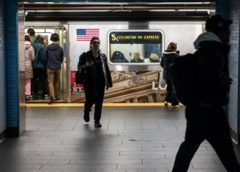 People exit and enter a subway car at a Manhattan subway station in March . ©AFP