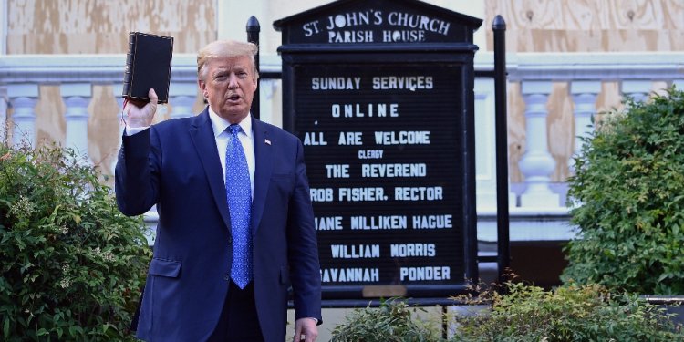 Then US president Donald Trump holds up a Bible outside of St John's Episcopal church near the White House in June 2020 after peaceful protesters were ejected from the area / ©AFP