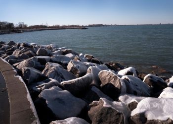 Ice collects on boulders along the Lake Michigan shoreline on February 18, 2024 in Whiting, Indiana; the Great Lakes shorelines have historically been ice-covered this time of year, but this winter's warm weather has led to historically low ice cover. ©AFP