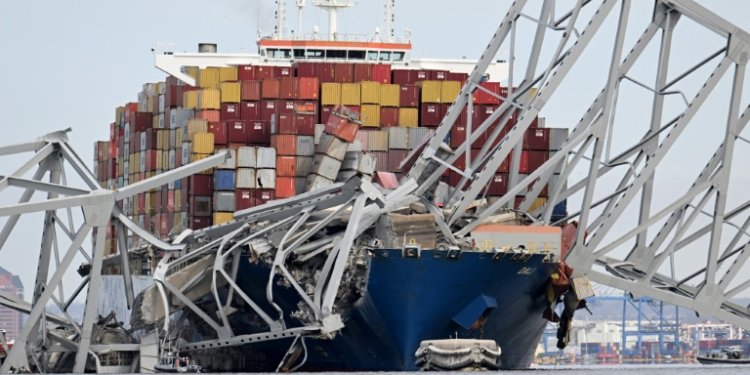 Footage of the collision showed packed container ship the Dali slamming into one of the bridge's supports, causing the 47-year-old structure to collapse. ©AFP