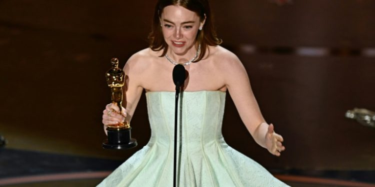 Emma Stone was emotional as she accepted the best actress Oscar for 'Poor Things' -- it is her second Academy Award. ©AFP