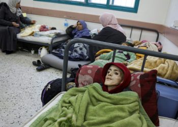 Ten-year-old Palestinian boy, Yazan al-Kafarneh, displaced from Beit Hanun and suffering from a pre-existing condition, lies on a hospital bed at Al-Awda clinic in Rafah; he died on March 4 severe malnourishment and insufficient healthcare. ©AFP