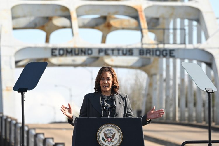 US Vice President Kamala Harris speaks at the Edmund Pettus Bridge during an event to commemorate the 59th anniversary of Bloody Sunday in Selma, Alabama / ©AFP