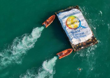 This picture released by the Israeli army shows a barge laden with food for Gaza being pushed towards a makeshift jetty for unloading after it was towed from Cyprus in a trial run for a new maritime aid corridor. ©AFP