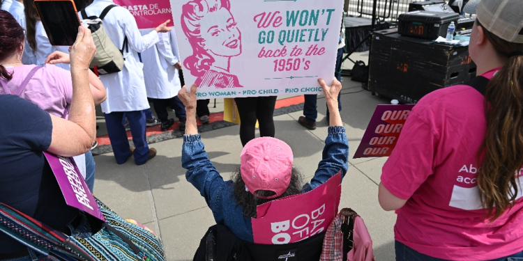 Emotions ran deep outside the courtroom where hundreds of women's rights activists, some draped in red-stained sheets, shouted Abortion is health care! Anti-abortion activists also arrived in large numbers and chanted slogans / ©AFP