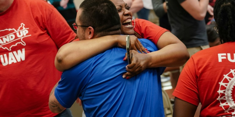 People celebrate after the United Auto Workers (UAW) received enough votes to form a union at a UAW vote watch party on April 19, 2024 in Chattanooga, Tennessee. ©AFP