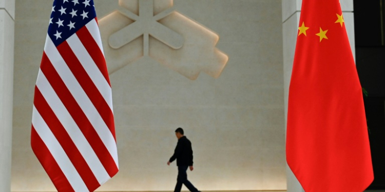 The US and China flags at the People's Bank of China prior to the arrival of US Treasury Secretary Janet Yellen to the central bank's headquarters in Beijing. ©AFP