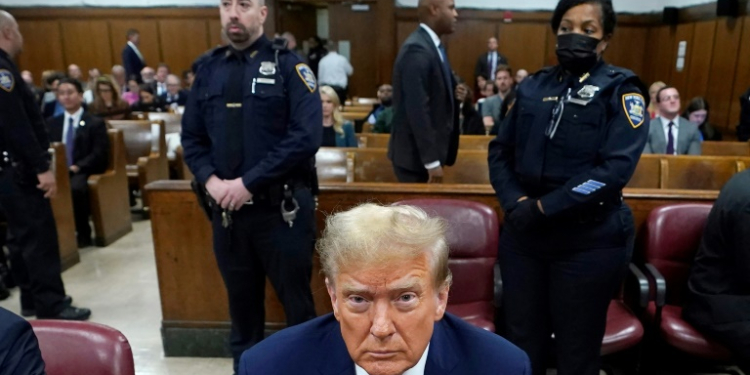 Former US President Donald Trump attends his trial for allegedly covering up hush money payments linked to extramarital affairs. ©AFP