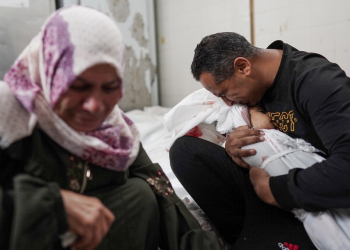 Palestinians mourn family members killed in overnight Israeli bombardment on the Nuseirat refugee camp in central Gaza, at the al-Aqsa Martyrs Hospital in Deir el-Balah on April 10, 2024 / ©AFP