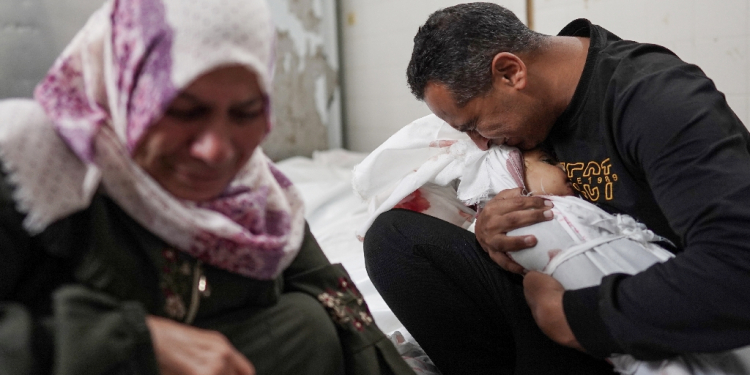 Palestinians mourn family members killed in overnight Israeli bombardment on the Nuseirat refugee camp in central Gaza, at the al-Aqsa Martyrs Hospital in Deir el-Balah on April 10, 2024 / ©AFP