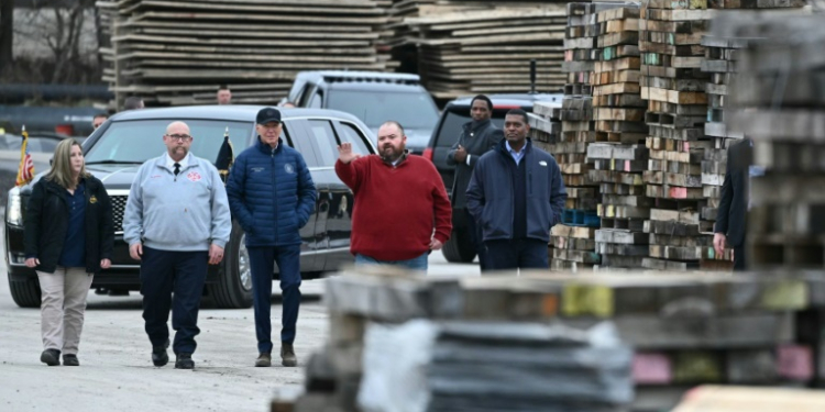 US President Joe Biden in February visited the site of a major freight train wreck in East Palestine, Ohio, that spewed toxic chemicals, prompting the company to settle numerous lawsuits for $600 million. ©AFP