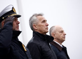 NATO Secretary General Jens Stoltenberg (C), flanked by the Chair of NATO's Military Committee Admiral Rob Bauer (L), and NATO Deputy Secretary General Mircea Geoana (R) attend a wreath laying ceremony for the alliance's 75th anniversary in Brussels. ©AFP