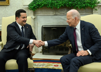 US President Joe Biden (R) shakes hands with the Prime Minister of Iraq Mohammed Shia al-Sudani in the Oval Office of the White House in Washington, DC on April 15, 2024.   Sudani's trip to Washington, his first since taking office in October 2022, was originally expected to focus on the presence of US troops in Iraq as part of an anti-jihadist coalition. But the meeting will now be dominated by the fractious situation in the region after Iraq's neighbor Iran launched a massive missile and drone assault on Israel on April 13, 2024. . ©AFP