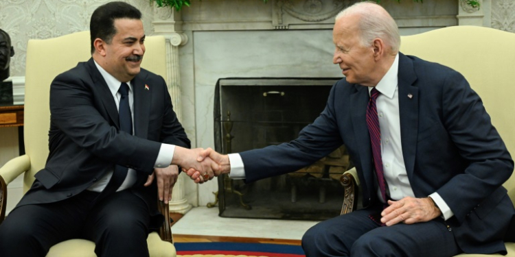 US President Joe Biden (R) shakes hands with the Prime Minister of Iraq Mohammed Shia al-Sudani in the Oval Office of the White House in Washington, DC on April 15, 2024.   Sudani's trip to Washington, his first since taking office in October 2022, was originally expected to focus on the presence of US troops in Iraq as part of an anti-jihadist coalition. But the meeting will now be dominated by the fractious situation in the region after Iraq's neighbor Iran launched a massive missile and drone assault on Israel on April 13, 2024. . ©AFP