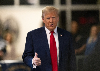 Former US President Donald Trump speaks to the media as he arrives for his trial for allegedly covering up hush money payments linked to extramarital affairs / ©AFP