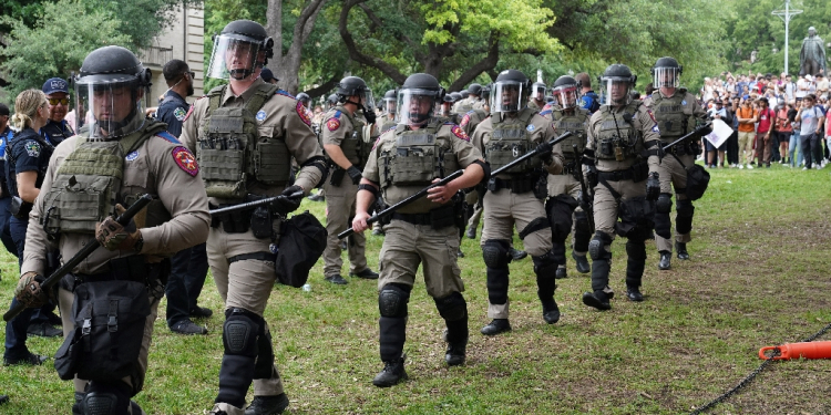 Texas state troopers walk on the campus of the University of Texas as pro-Palestinian students protest the Israel-Hamas war in Austin on April 24, 2024 / ©AFP