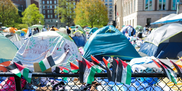 Palestinian flags are seen around the encampment on the campus of Columbia University in New York City on April 23, 2024 / ©AFP