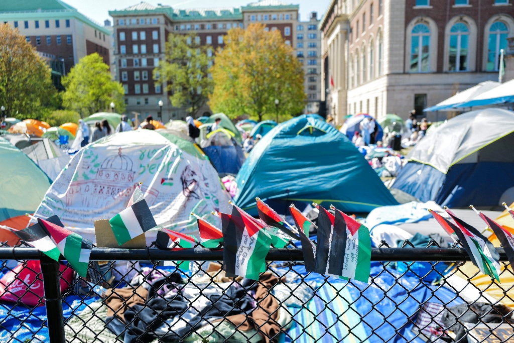 Palestinian flags are seen around the encampment on the campus of Columbia University in New York City on April 23, 2024 / ©AFP