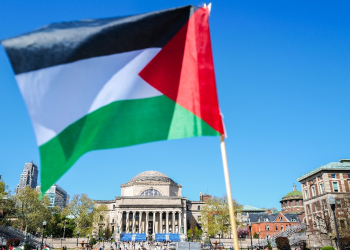 A Palestinian flag is seen around the protest encampment on the campus of Columbia University in New York City on April 23, 2024 / ©AFP