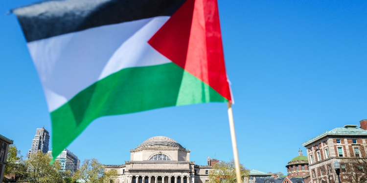 A Palestinian flag is seen around the protest encampment on the campus of Columbia University in New York City on April 23, 2024 / ©AFP