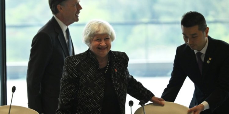 US Treasury chief Janet Yellen (C) and Ambassador to China Nicholas Burns (L) attend a roundtable with business leaders in Guangzhou. ©AFP