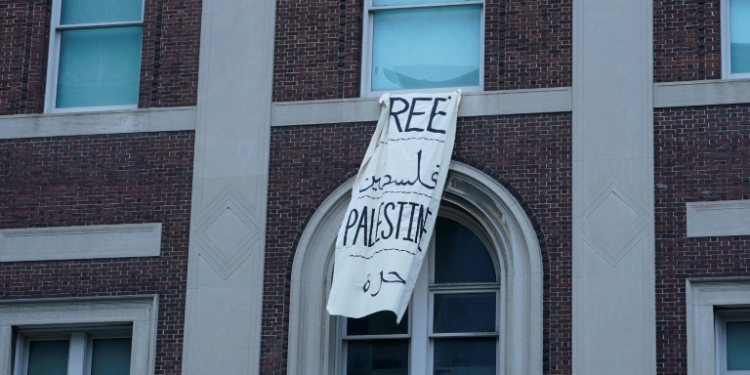 A 'Free Palestine' banner hangs on a Columbia University building on April 30, 2024 . ©AFP