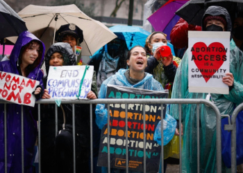 Pro abortion rights activists hold placards during the annual anti-abortion demonstration in New York City, on March 23, 2024. ©AFP