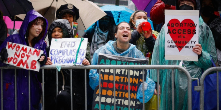 Pro abortion rights activists hold placards during the annual anti-abortion demonstration in New York City, on March 23, 2024. ©AFP