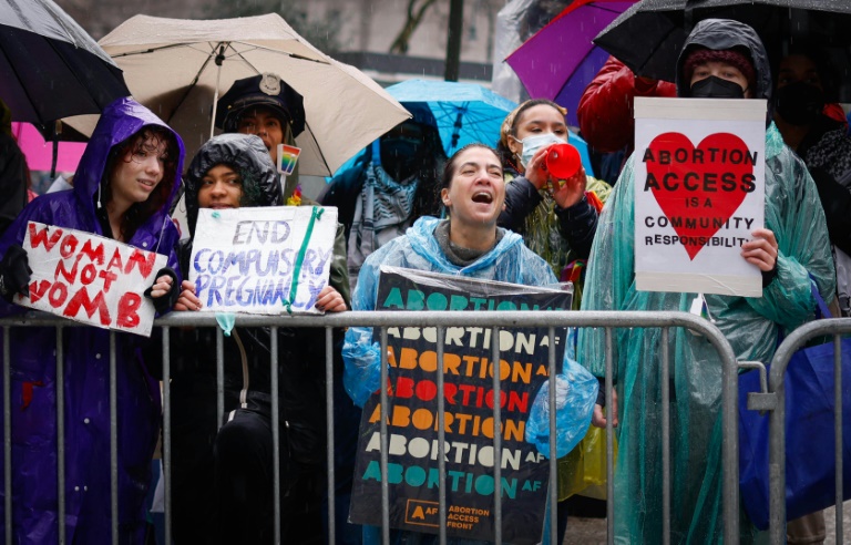 Pro abortion rights activists hold placards during the annual anti-abortion demonstration in New York City, on March 23, 2024. ©AFP