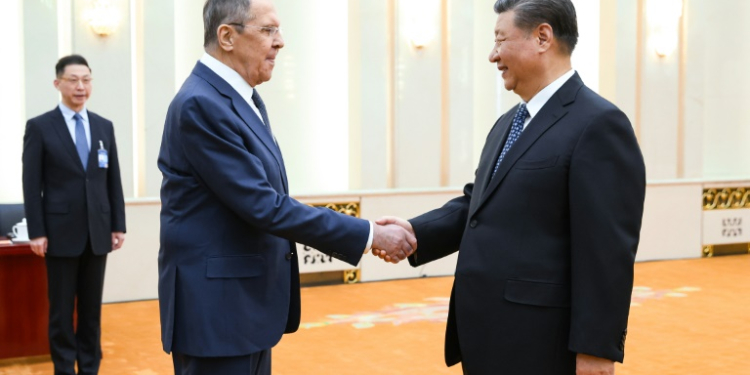 China and Russia said they would strengthen strategic cooperation as Foreign Minister Sergei Lavrov (L) held talks with President Xi Jinping (R) and top diplomat Wang Yi. ©AFP