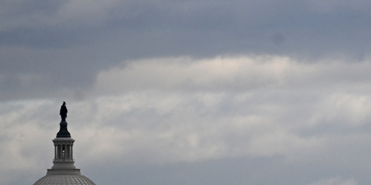 The dome of the US Capitol is seen on a cloudy day in Washington, DC in January 2024 / ©AFP