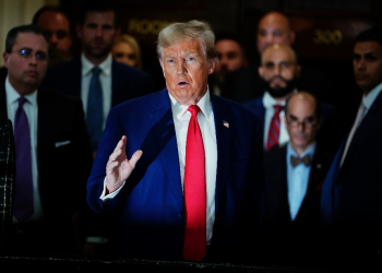 Former US president Donald Trump speaks to the press during a civil fraud trial against the Trump Organization in New York in January 2024 / ©AFP