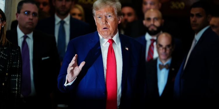 Former US president Donald Trump speaks to the press during a civil fraud trial against the Trump Organization in New York in January 2024 / ©AFP