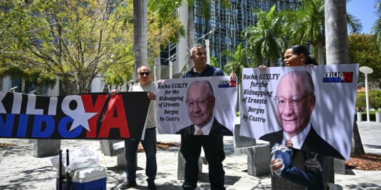 People protest demanding the "maximum sentence" for the former US Ambassador to Bolivia, Victor Manuel Rocha, who admitted to spying for Cuba, outside a courthouse in Miami, Florida on April 12, 2024. ©AFP