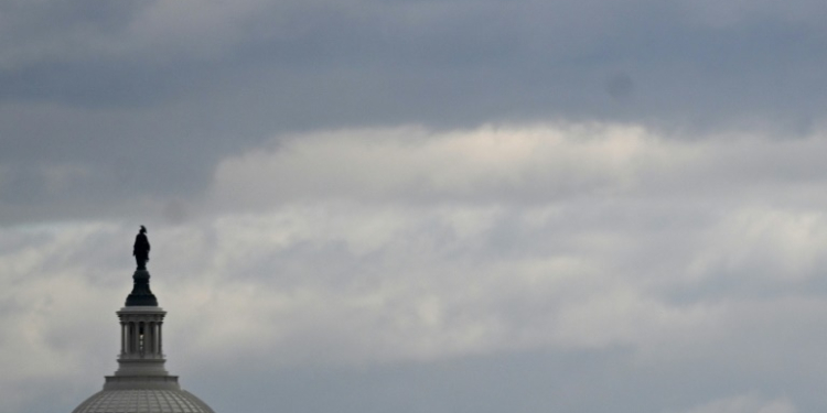 The dome of the US Capitol is seen on a cloudy day in Washington, DC in January 2024. ©AFP