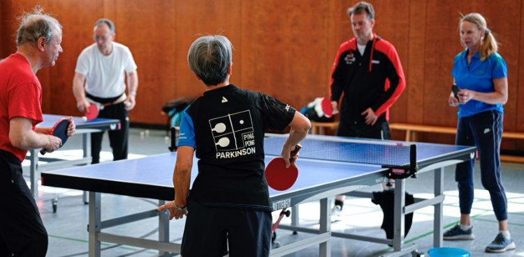 People play table tennis at the Ping Pong Parkinson initiative in Berlin on April 11, 2023, World Parkinson's Day -- the devastating disorder affects 10 million people worldwide. ©AFP