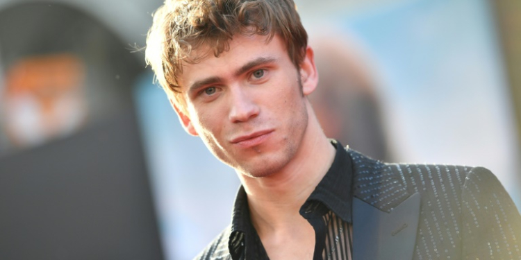 Actor Owen Teague, who stars in 20th Century's 'Kingdom of the Planet of the Apes,' poses during the film's world premiere in Hollywood, California on May 2, 2024 . ©AFP