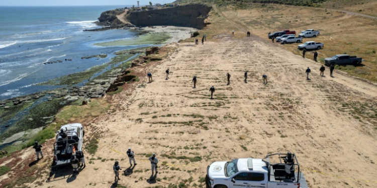 State prosecutors search the camping site of two Australians and an American murdered during a surfing trip to Mexico. ©AFP