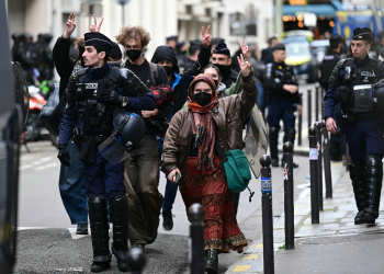 Student demonstrators were escorted out of the Sciences Po building by police / ©AFP