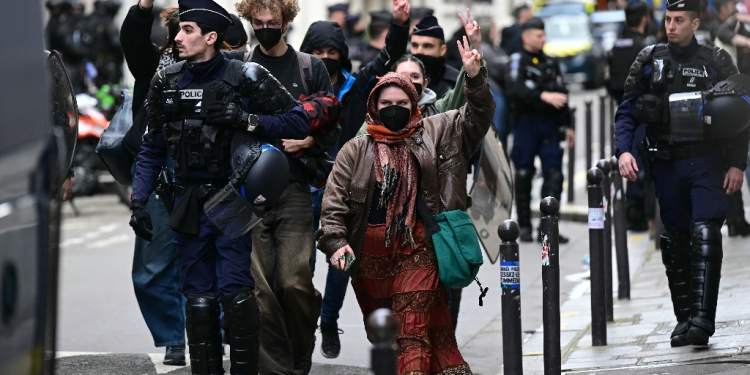 Student demonstrators were escorted out of the Sciences Po building by police / ©AFP