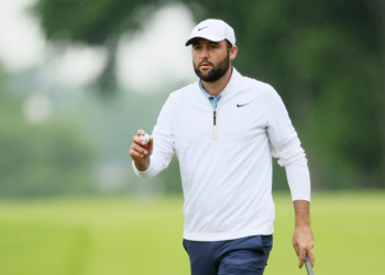 World number one Scottie Scheffler reacts after a birdie at the par-5 10th hole in the second round of the PGA Championship after being arrested hours before the round. ©AFP