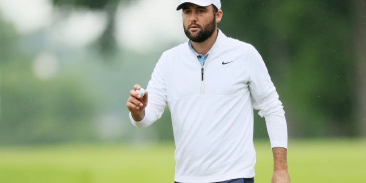 World number one Scottie Scheffler reacts after a birdie at the par-5 10th hole in the second round of the PGA Championship after being arrested hours before the round. ©AFP