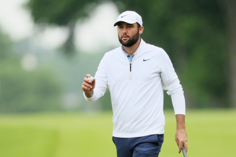 World number one Scottie Scheffler reacts after a birdie at the par-5 10th hole in the second round of the PGA Championship after being arrested hours before the round. ©AFP